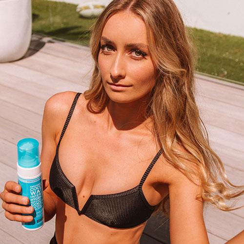 tanned woman in Coconut Water Self Tan Foam